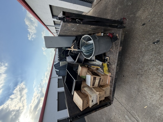 2Mexicans branded pink trailer loaded with junk at storage facility